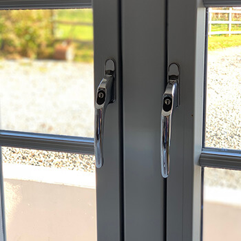 uPVC window with chrome handles